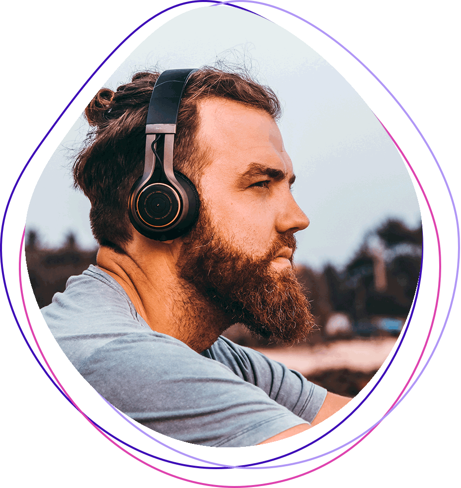 Image of man listening music on headphones 